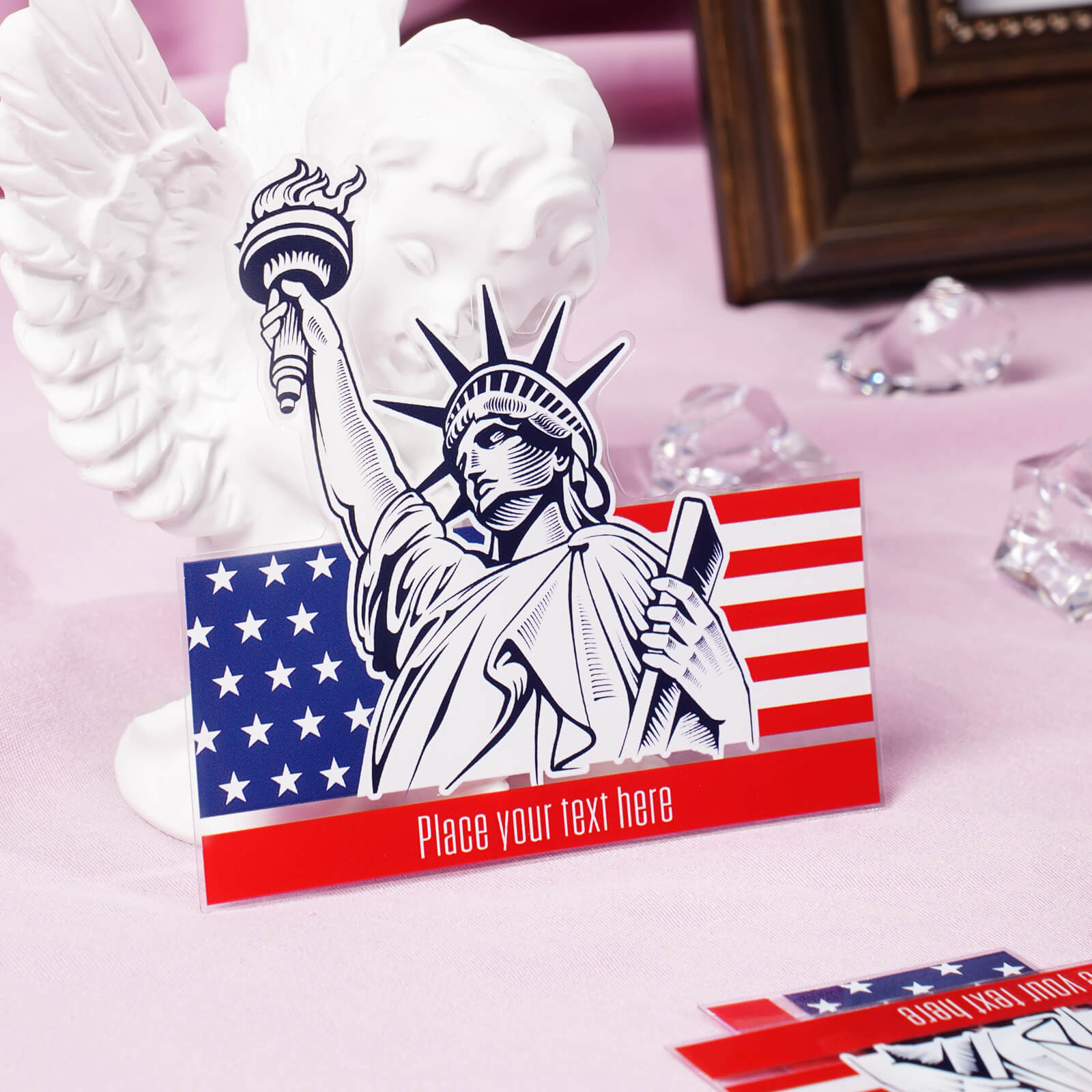Statue of Liberty-themed card with a customizable text area on a decorative table.