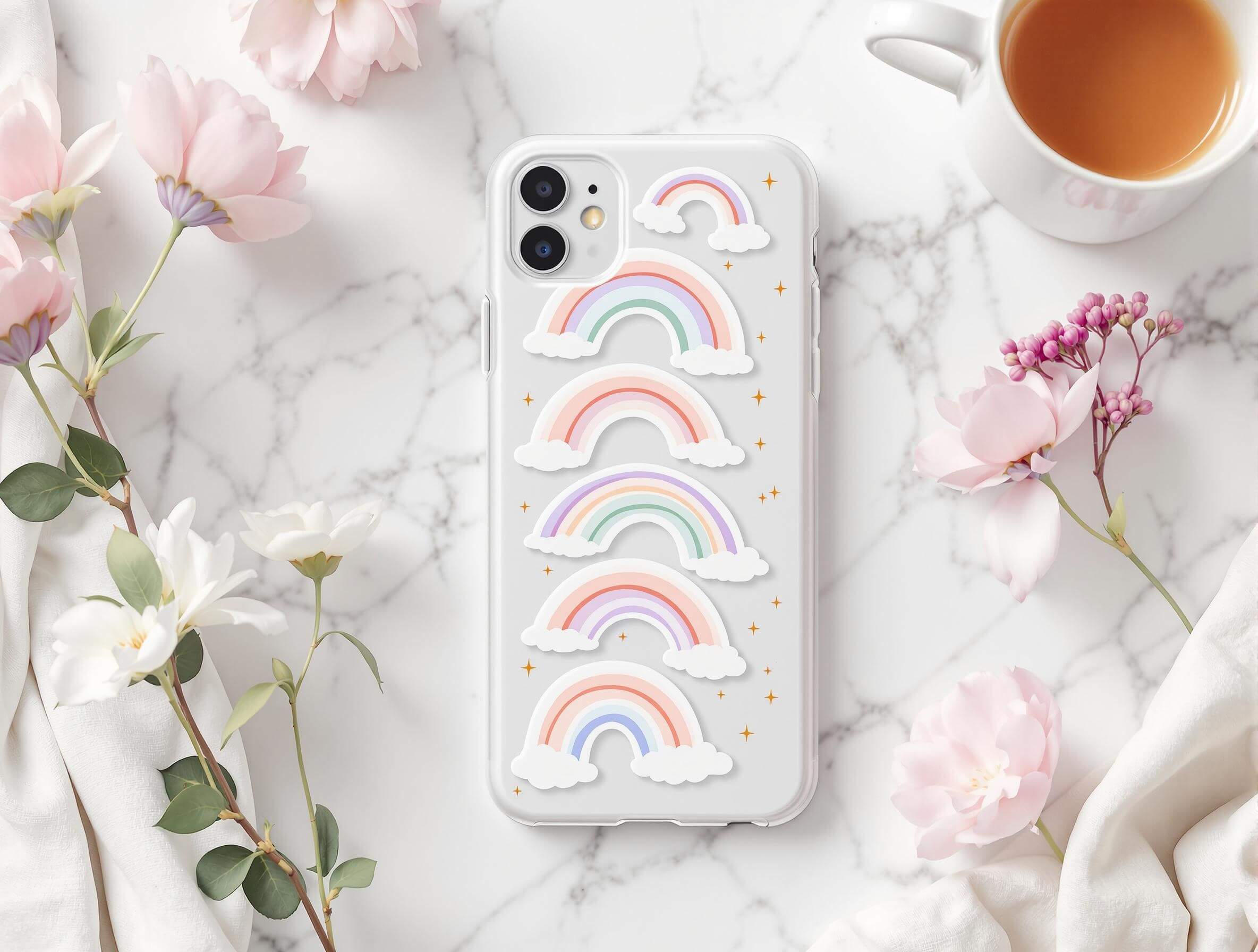 Pastel rainbow stickers on a phone case with flowers and tea.